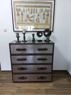 a dresser with a painting on the wall at MAFI AS APARTMAN in Soko Banja