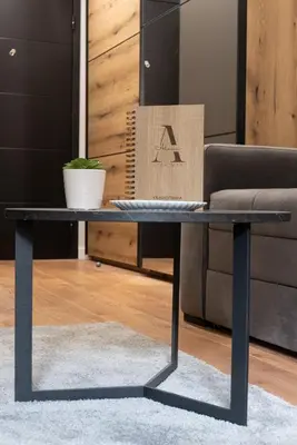 a black coffee table in a living room with a couch at Apartman Aleni - Bela Reka, Brzeće in Brzeće