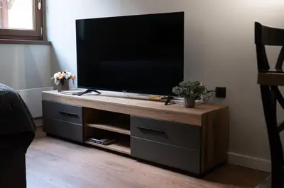 a entertainment center with a flat screen tv on it at Apartman Aleni - Bela Reka, Brzeće in Brzeće