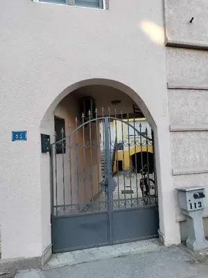 an entrance to a building with a gate at Prenoćiste Živković in Pirot