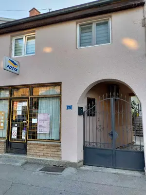 a building with an entrance to a store with a door at Prenoćiste Živković in Pirot