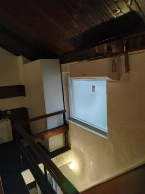 an empty room with a window in a kitchen at Prenoćiste Živković in Pirot