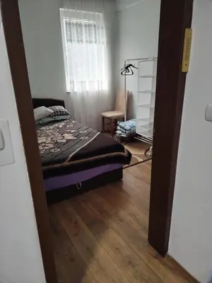 a bedroom with a bed and a chair in a room at BakaBaka in Pojate