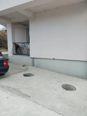 two metal man holes in a parking garage at BakaBaka in Pojate