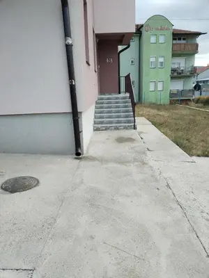 a set of stairs leading up to a building at BakaBaka in Pojate