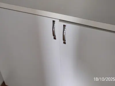 a white kitchen counter with black drawer pulls at BakaBaka in Pojate