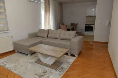 a living room with a couch and a coffee table at Dobi Apartmani WING 7 in Jagodina