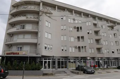 a large apartment building on the corner of a street at Dobi Apartmani WING 7 in Jagodina