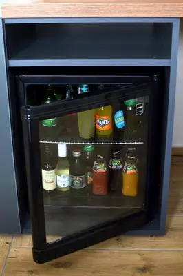 a small refrigerator filled with different types of drinks at ĆAKA Luxury Rooms & Restaurant in Ćuprija