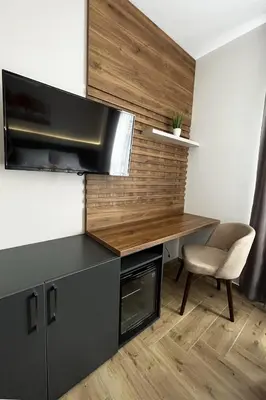 a kitchen with a desk and a chair at ĆAKA Luxury Rooms & Restaurant in Ćuprija