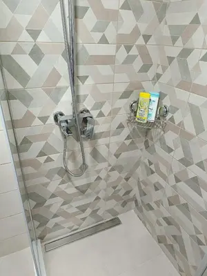 a bathroom with a shower with a glass door at Apartment Eight - Pirot in Pirot