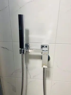 a phone on a wall in a bathroom at Urban Chic Studio in Niš