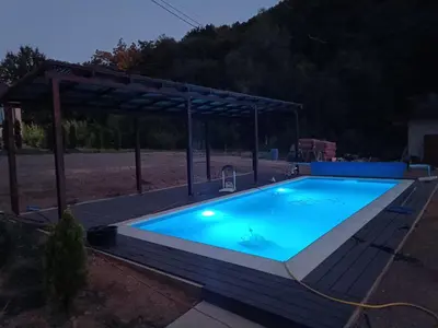 a large swimming pool with a cover over it at Milica 1 Mezdrejska 87 in Kalna
