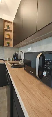 a kitchen with a counter top with a toaster at Kovan Lux 9 Sokobanja in Soko Banja