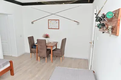 a dining room with a table and chairs at Apartmani Homoljsko Jutro ☆☆☆☆ Apartments Homolje Morning ☆☆☆☆ in Žagubica