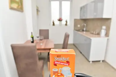 a box of breakfast cereal sitting on a table in a kitchen at Apartmani Homoljsko Jutro ☆☆☆☆ Apartments Homolje Morning ☆☆☆☆ in Žagubica