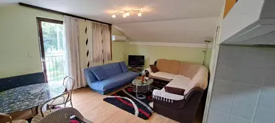 a living room with a couch and a chair at Apartman Jova in Vrnjačka Banja