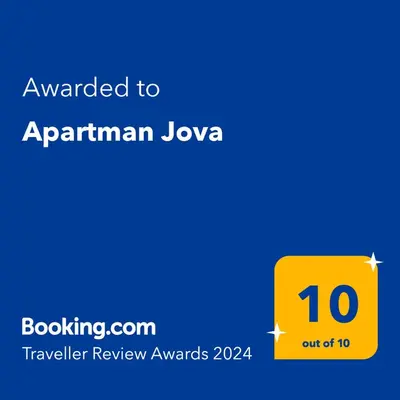 a yellow box with the text awarded to armenian loyalty at Apartman Jova in Vrnjačka Banja