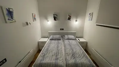 a small room with a bed in the corner at Vila Pahulja - Konoba 1 in Kopaonik