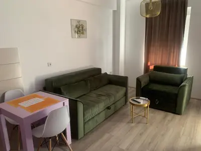 a living room with a couch and a table at De Lux Nedeljkovic in Jagodina
