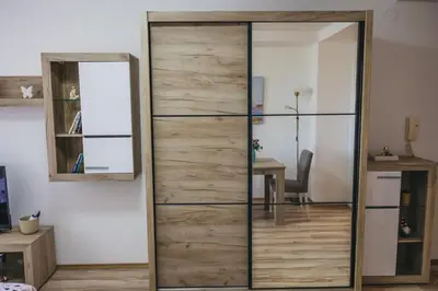 a sliding glass door with a mirror in a room at RIVERVIEW in Niš