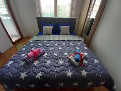 a bedroom with a bed with stars on it at Luka Lux in Niš