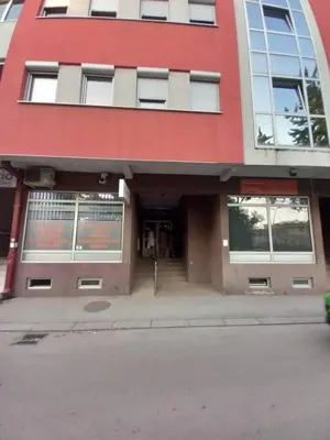 a building on the corner of a street at Luka Lux in Niš