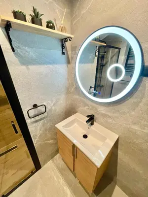 a bathroom with a sink and a mirror at Aqua Casa in Vrnjačka Banja