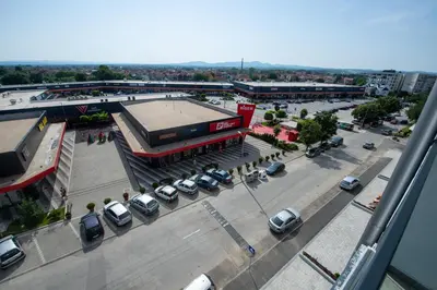an overhead view of a parking lot with cars parked at Petković apartmani 48 in Jagodina