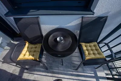 an overhead view of two chairs and a fire place at Petković apartmani 31 STUDIO in Jagodina