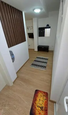 an empty room with a hallway with a stairway at Apartman Muzika Jagodina in Jagodina