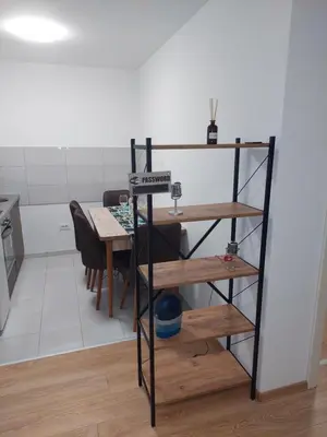 a room with a table and a dining room at Apartman Muzika Jagodina in Jagodina