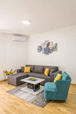 a living room with a couch and a table at Apartman Ina in Vrnjačka Banja