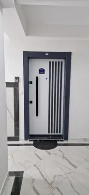 a white door with the number one on it at Apartman Ina in Vrnjačka Banja