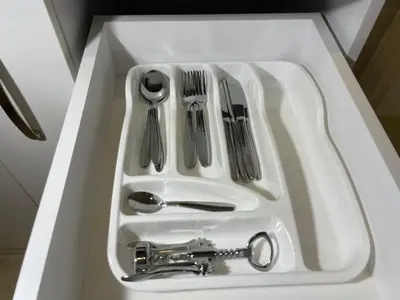 a white sink with utensils in it at Bora Apartmani - FREE PARKING - CITY CENTER in Vranje