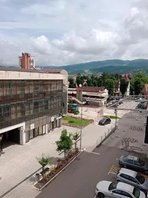 an aerial view of a city with a parking lot at Apartman Dragana in Pirot