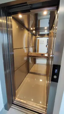 an empty refrigerator with its door open in a room at Lux Apartman Crnjanski II, Jagodina in Jagodina