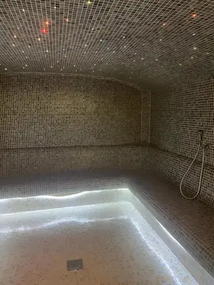 a bathroom with a bath tub in a room at Kopaonik Heights N97 Spa and Wellnes in Kopaonik