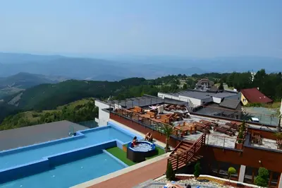 an aerial view of a house with a swimming pool at Kopaonik Heights N97 Spa and Wellnes in Kopaonik