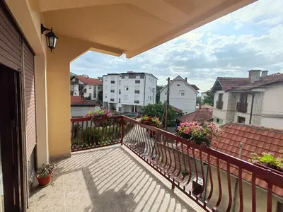 a balcony with a view of a city at City Park Rooms in Vranje