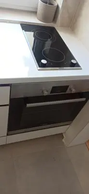 a black stove top oven in a kitchen at Lux apartment 10 center, free parking in Niš