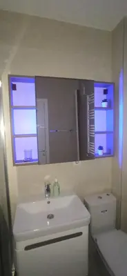 a bathroom with a sink and a toilet and two windows at Lux apartment 10 center, free parking in Niš