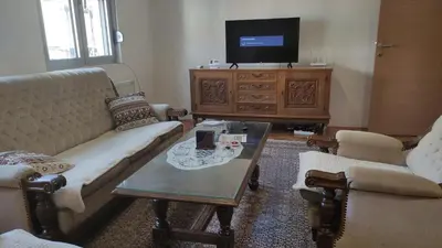 a living room with a couch and a coffee table at Stan na dan Nis in Niš