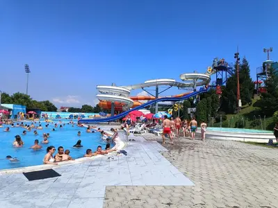 a group of people in a pool at a water park at Apartman ELENA in Jagodina