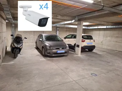 two cars and a motorcycle parked in a parking garage at Lux apartment 12 center, free parking in Niš