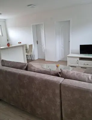 a living room with a couch and a table at Nada-S in Soko Banja