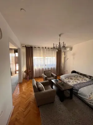 a living room with a bed and a couch at Devetka in Pirot