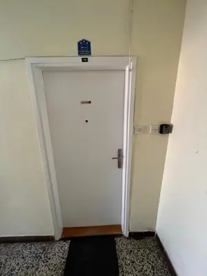 a white door with a sign on top of it at Devetka in Pirot