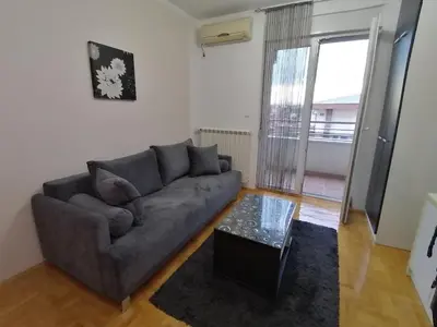 a living room with a couch and a coffee table at Apartman Breza 3 in Kruševac