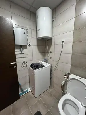 a bathroom with a toilet and a sink at Matic Apartmani 4 in Trnava